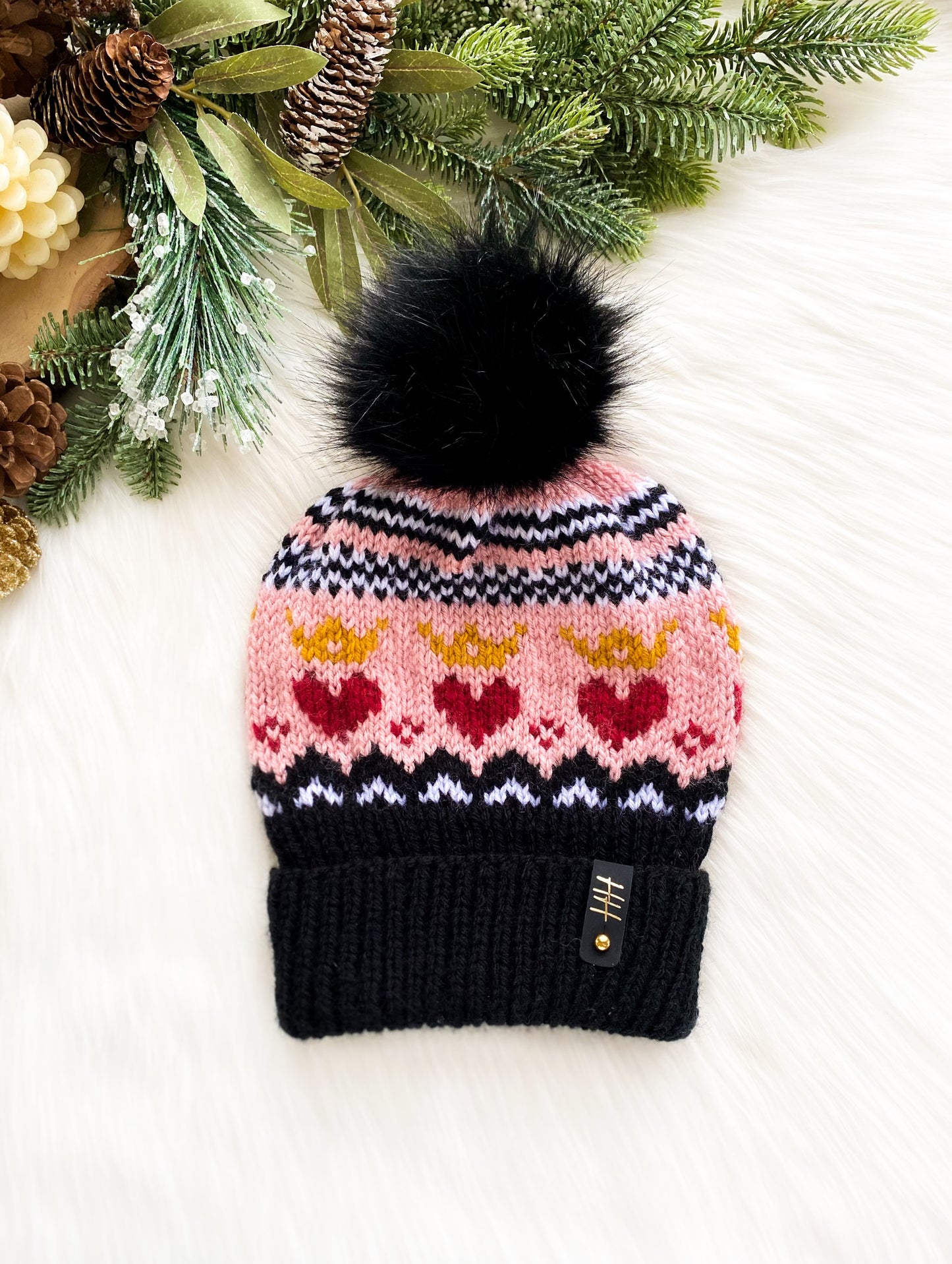 “Queen of Hearts” knitted fair isle hat with black pom
